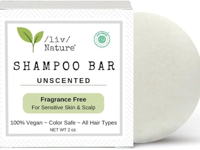 Product photo: white unscented shampoo bar beside box with green leaf logo