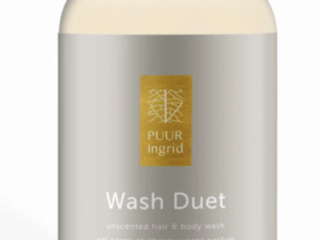 Photograph of beige and gold hair &amp; body wash bottle labeled Wash Duet