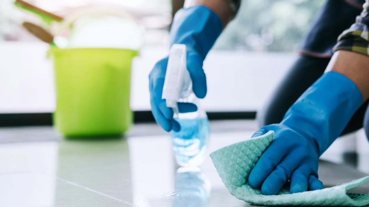 Photo of a person cleaning.