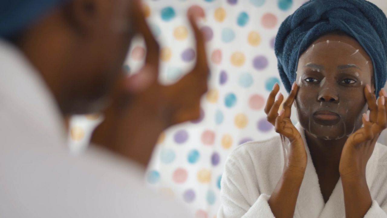 Person applying sheet mask