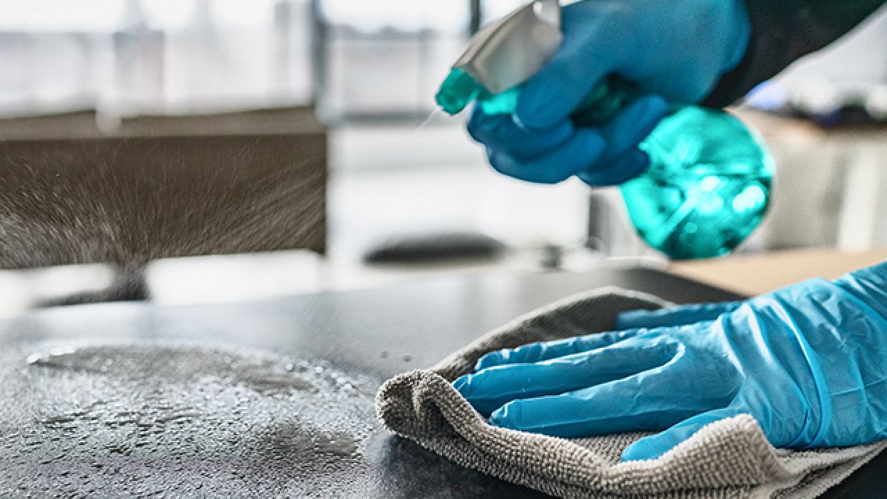 Cleaning spray being used on a table