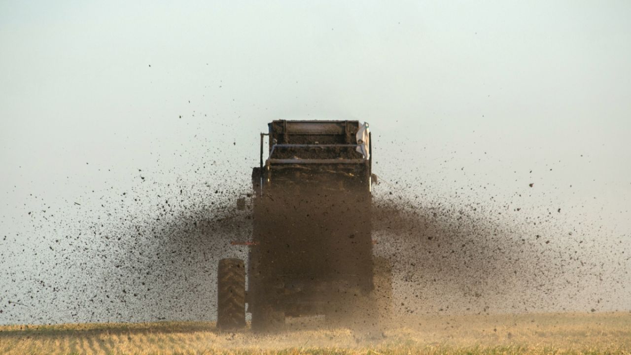 Manure spreader in field