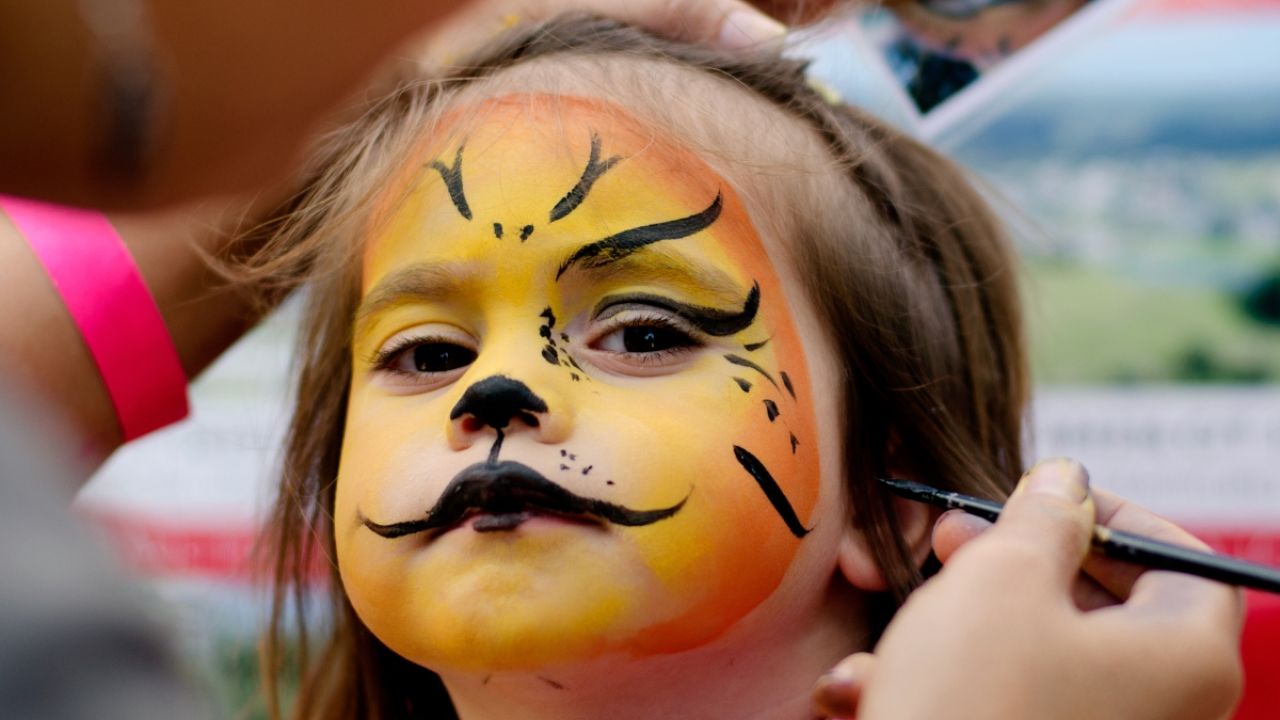 Child with Halloween facepaint on