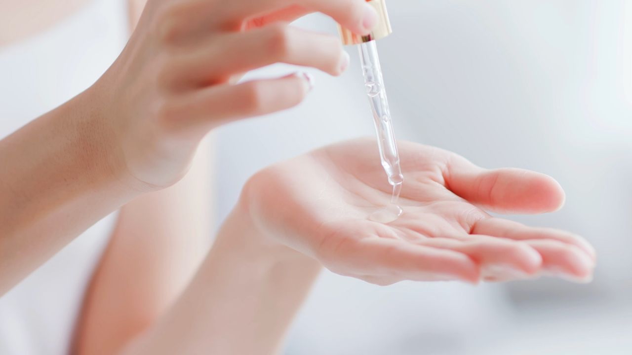 Women applying serum
