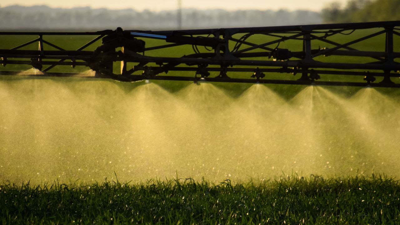Fertilizer being sprayed on a crop.