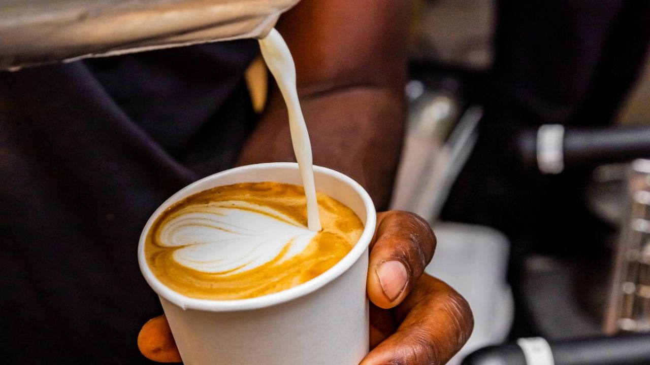 Person making a latte