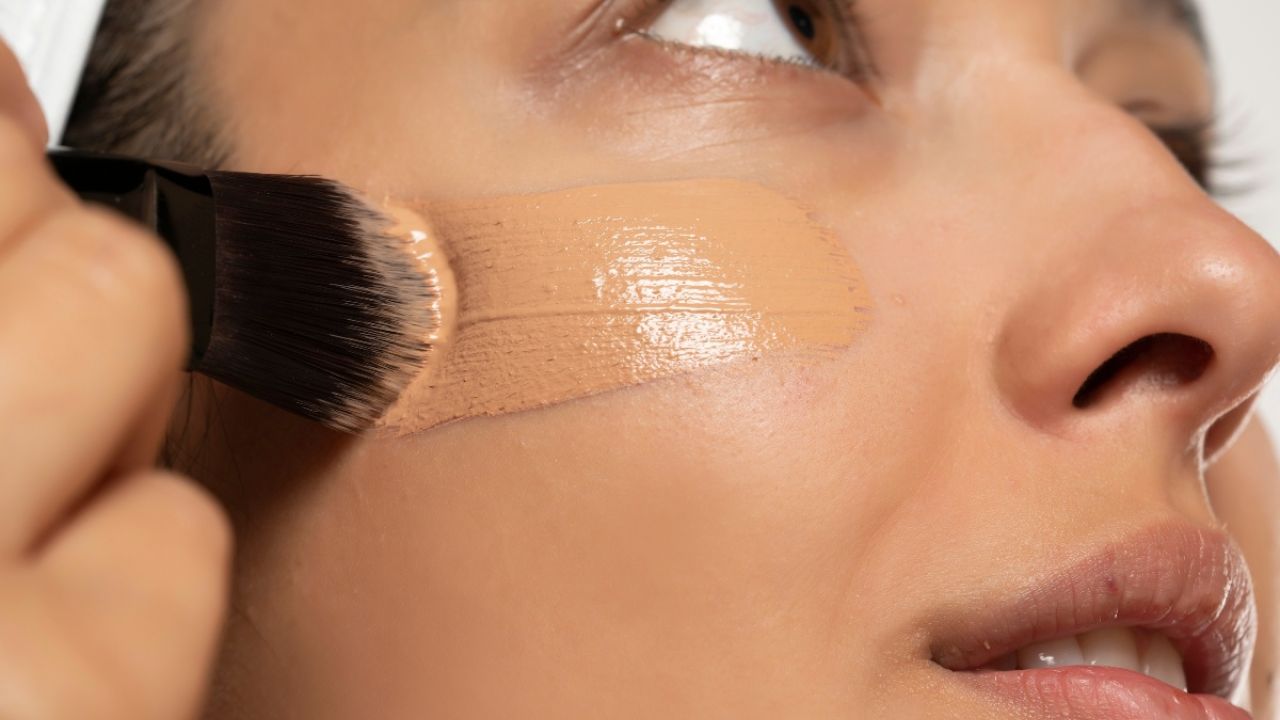 Woman applying foundation