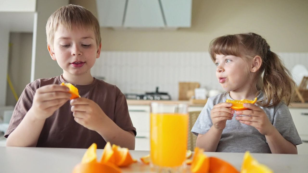 kids drinking OJ